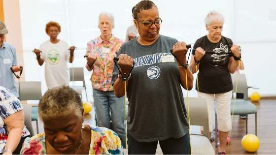Older adults taking part in a group fitness activity