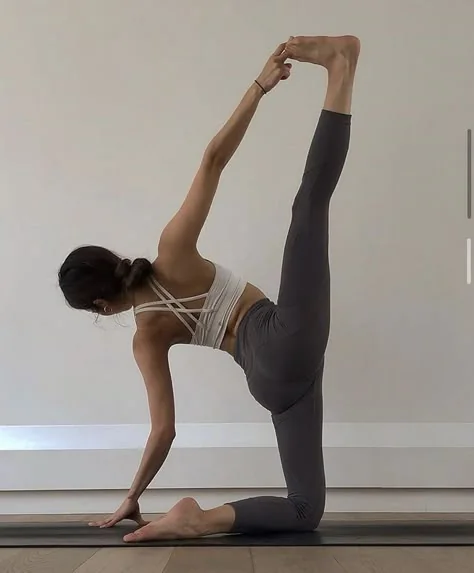 Woman practising a balancing yoga pose